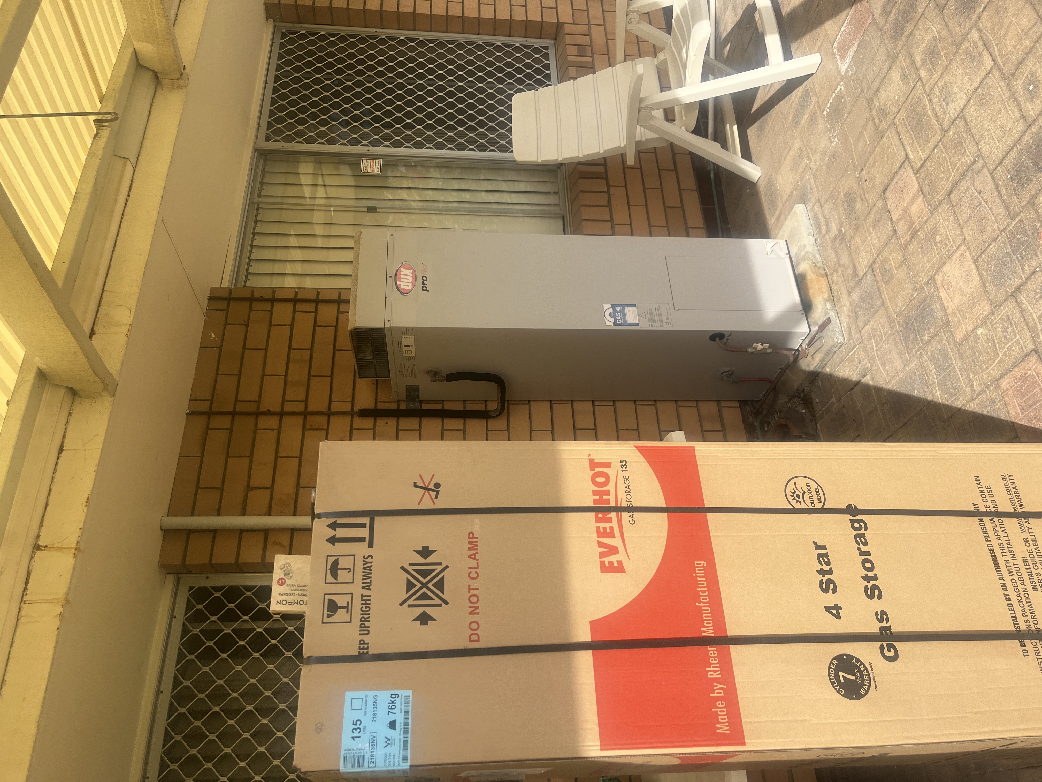 Everhot gas storage system upgrade beside an older unit under a patio