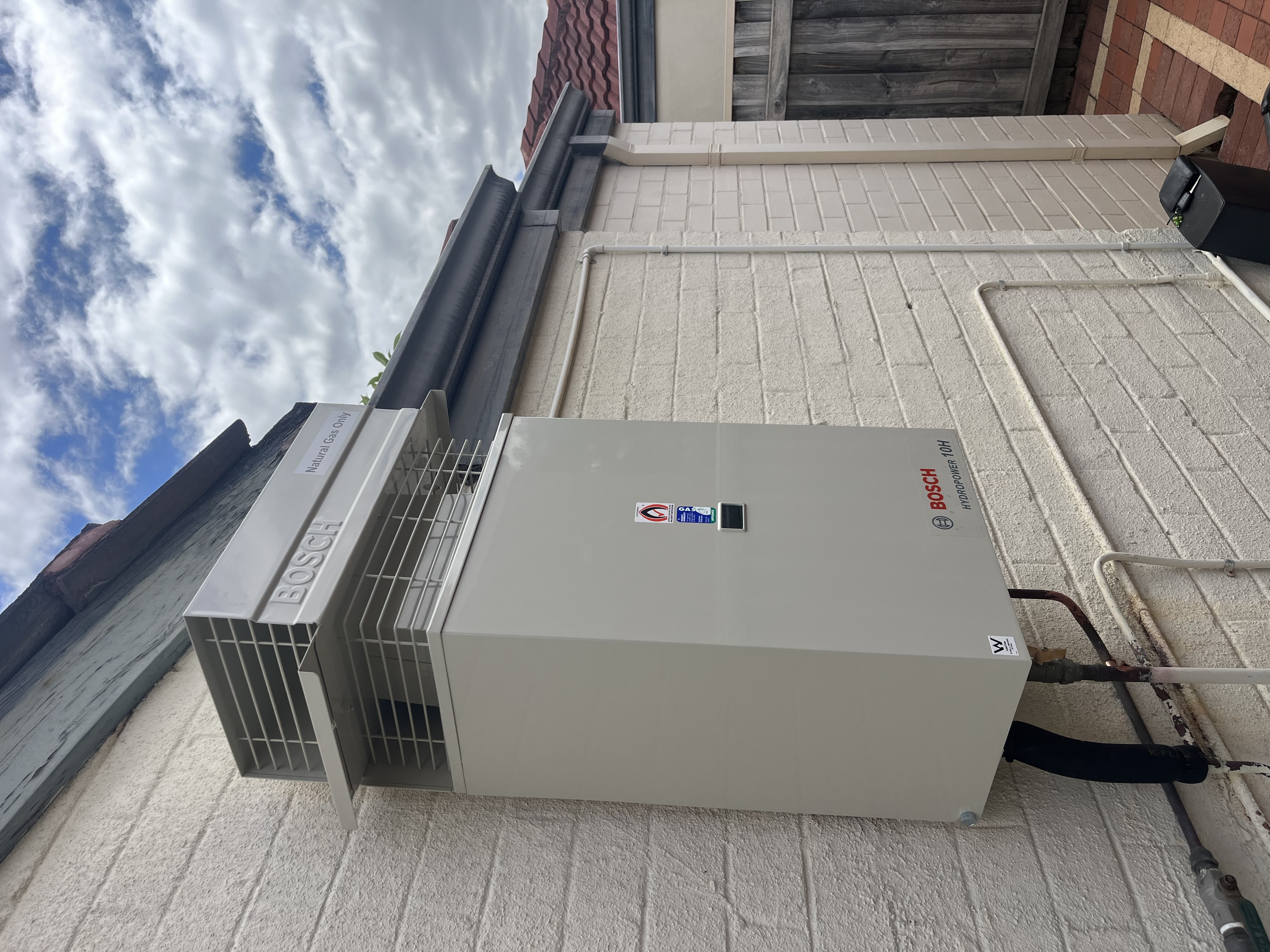 Bosch hydropower gas continuous flow unit mounted externally